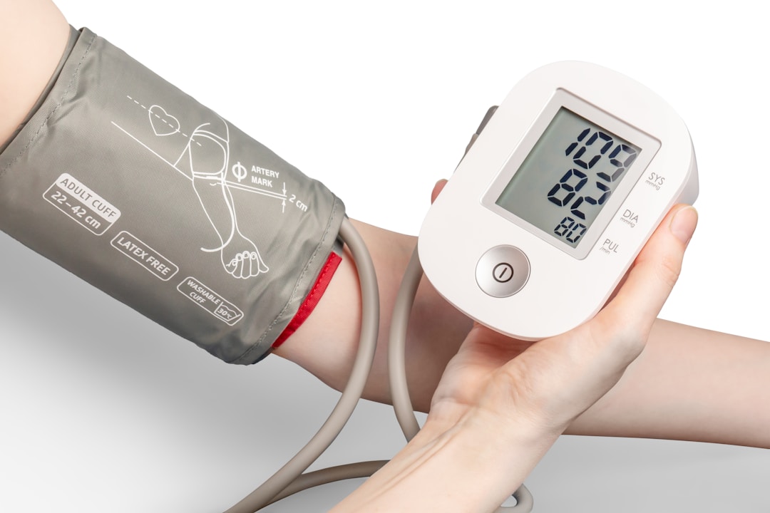A clinical pulse oximeter clipped to a finger, showing the same optical measurement principle that smart rings use in a much smaller package
