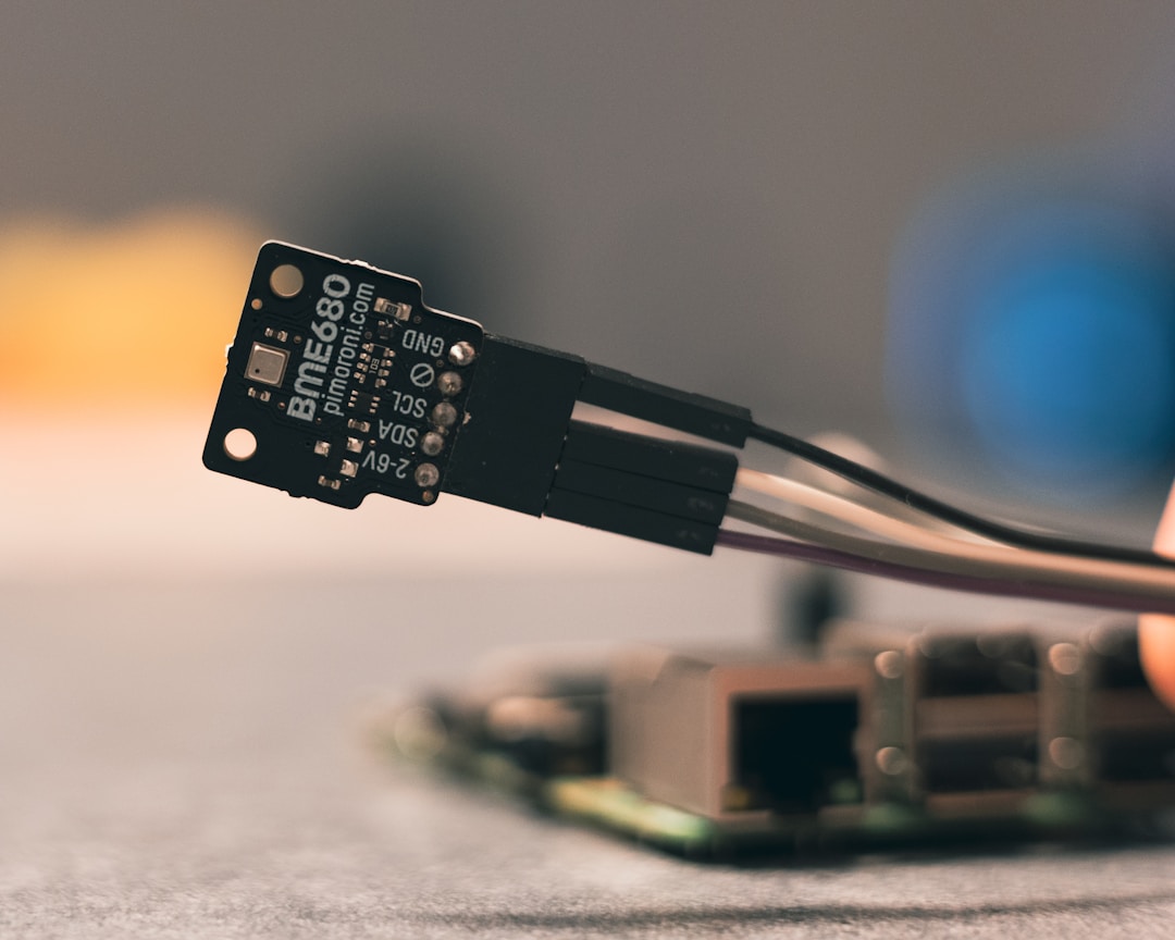 A close-up of an LED optical sensor circuit board used in biometric wearable devices
