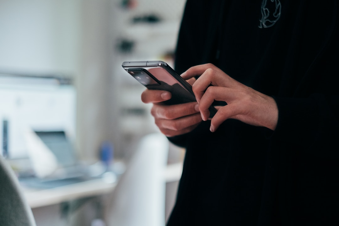 A smartphone screen showing a minimal dark interface without login forms or password fields