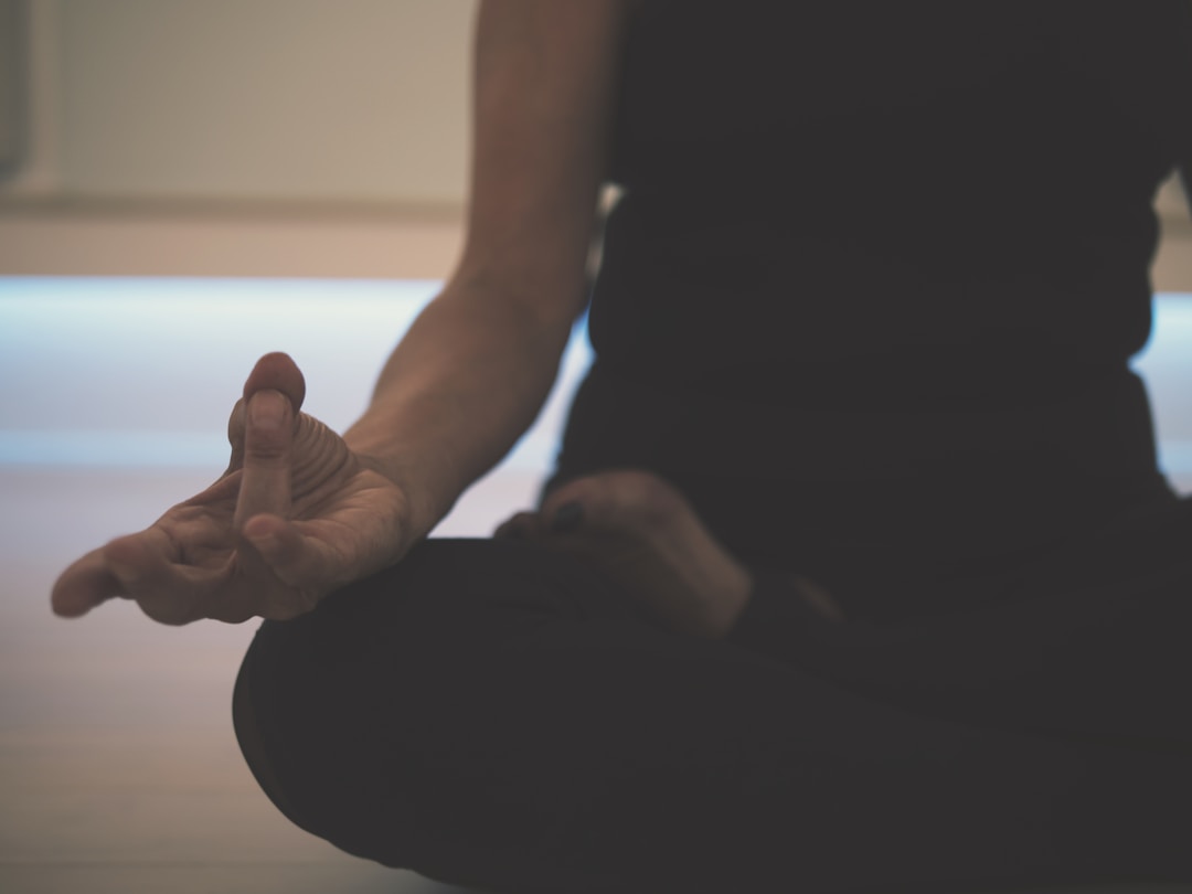 A person breathing deeply during meditation, illustrating the physical act of respiration that smart rings never actually measure