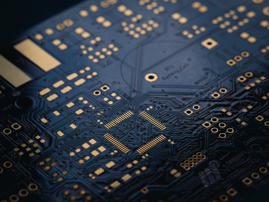A close-up of circuit boards on an assembly line, illustrating the physical reality of hardware production that crowdfunding campaigns must account for