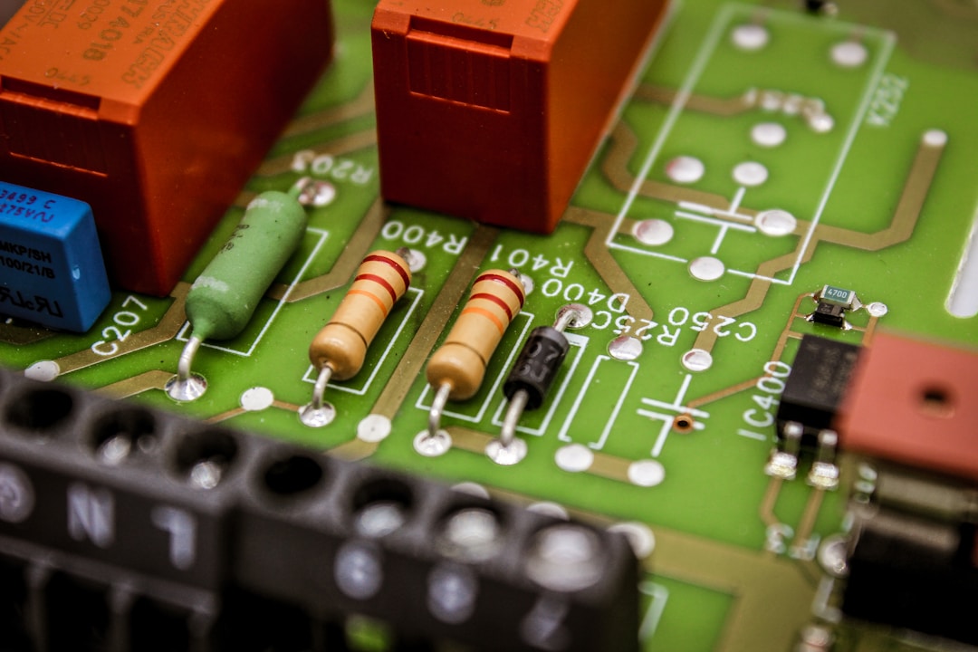 A closeup of a circuit board with components, representing the real hardware cost differences between a health sensor ring and a single-purpose voice recorder