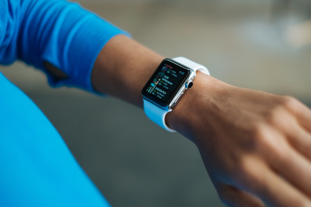 A fitness tracker dashboard showing multiple rings and metrics. The interface design that turns physiological complexity into a single digestible number, and the psychological cost of that simplification