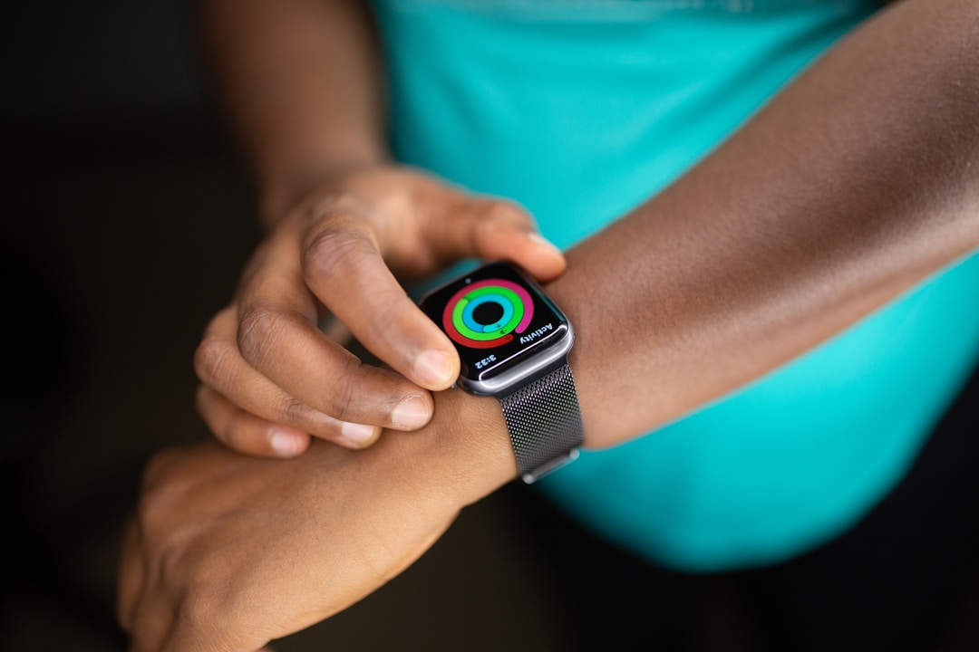 A close-up of a smartwatch face showing health metrics : the same sensors that fit inside a watch now squeeze into a ring barely thicker than a wedding band