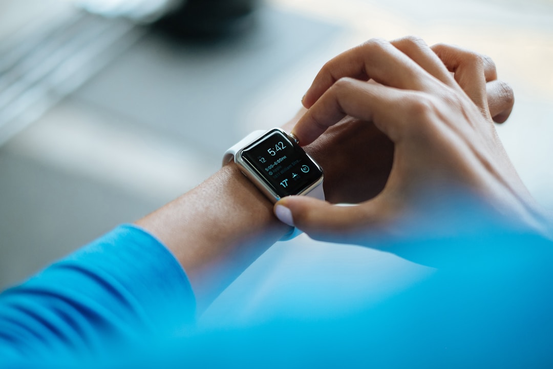 Smartwatch and wearable technology devices on a dark surface