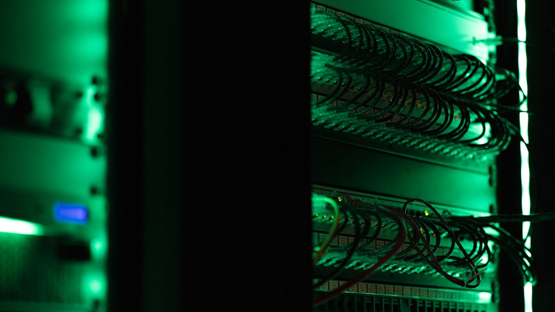 A dark abandoned server room with rows of silent racks. The physical place where your health data lives, and where it dies when the hosting bill stops getting paid.