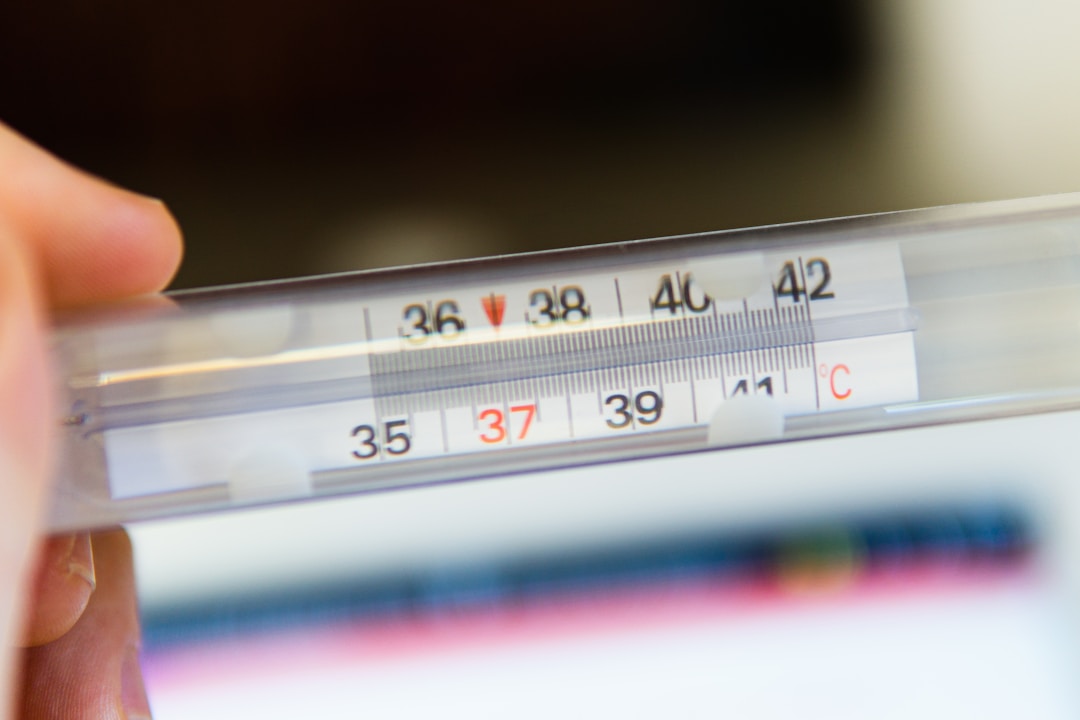 A close-up of a digital thermometer showing a precise reading. The kind of accuracy that smart rings promise but rarely deliver because of thermal lag and averaging algorithms