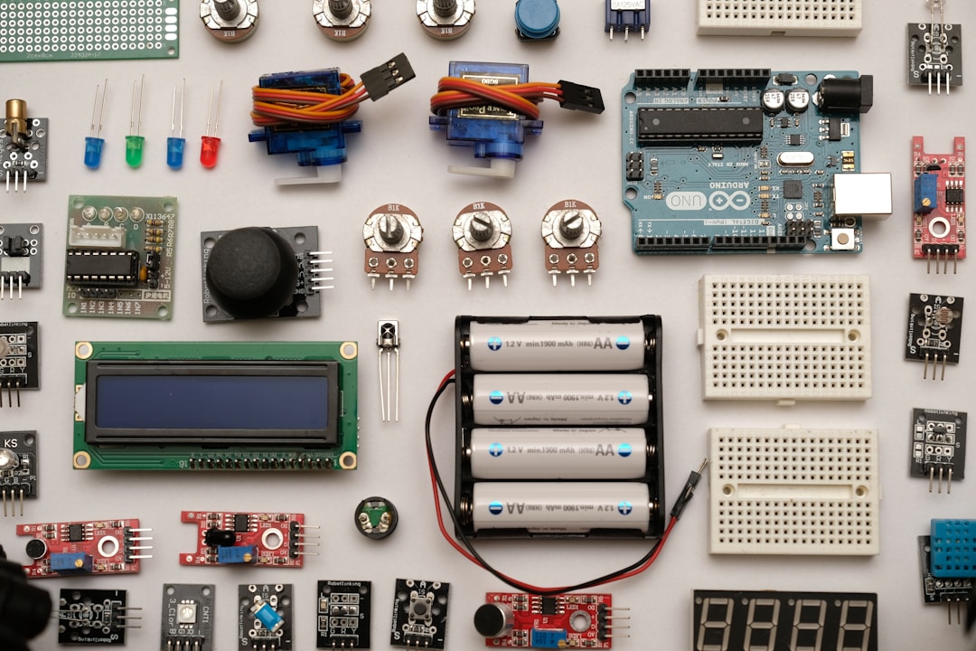 A DIY electronics workspace with soldering equipment and circuit boards, representing the growing community of users building open-source tools to reclaim their health data