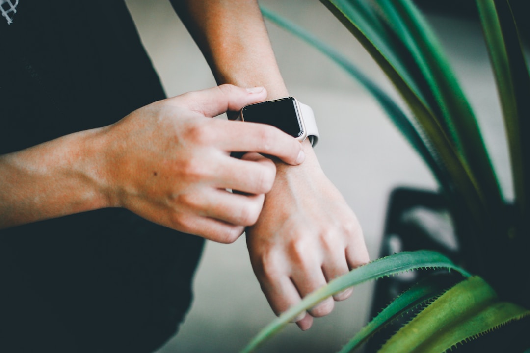 A USB-C charging cable connected to a small device showing the charging infrastructure that every smart ring relies on to counteract its tiny battery