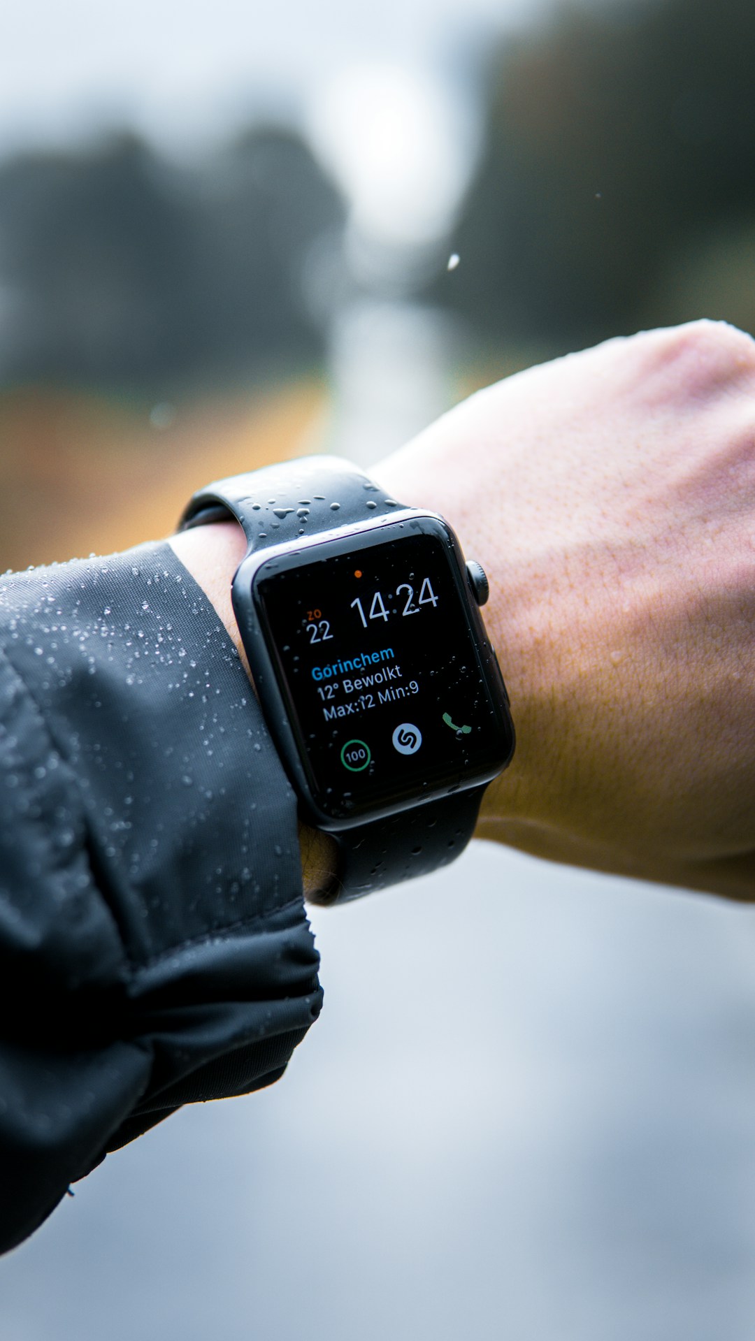 A wrist with a smartwatch in bed, illustrating the thermal and motion challenges that make wrist PPG less reliable for overnight sleep tracking compared to a finger ring