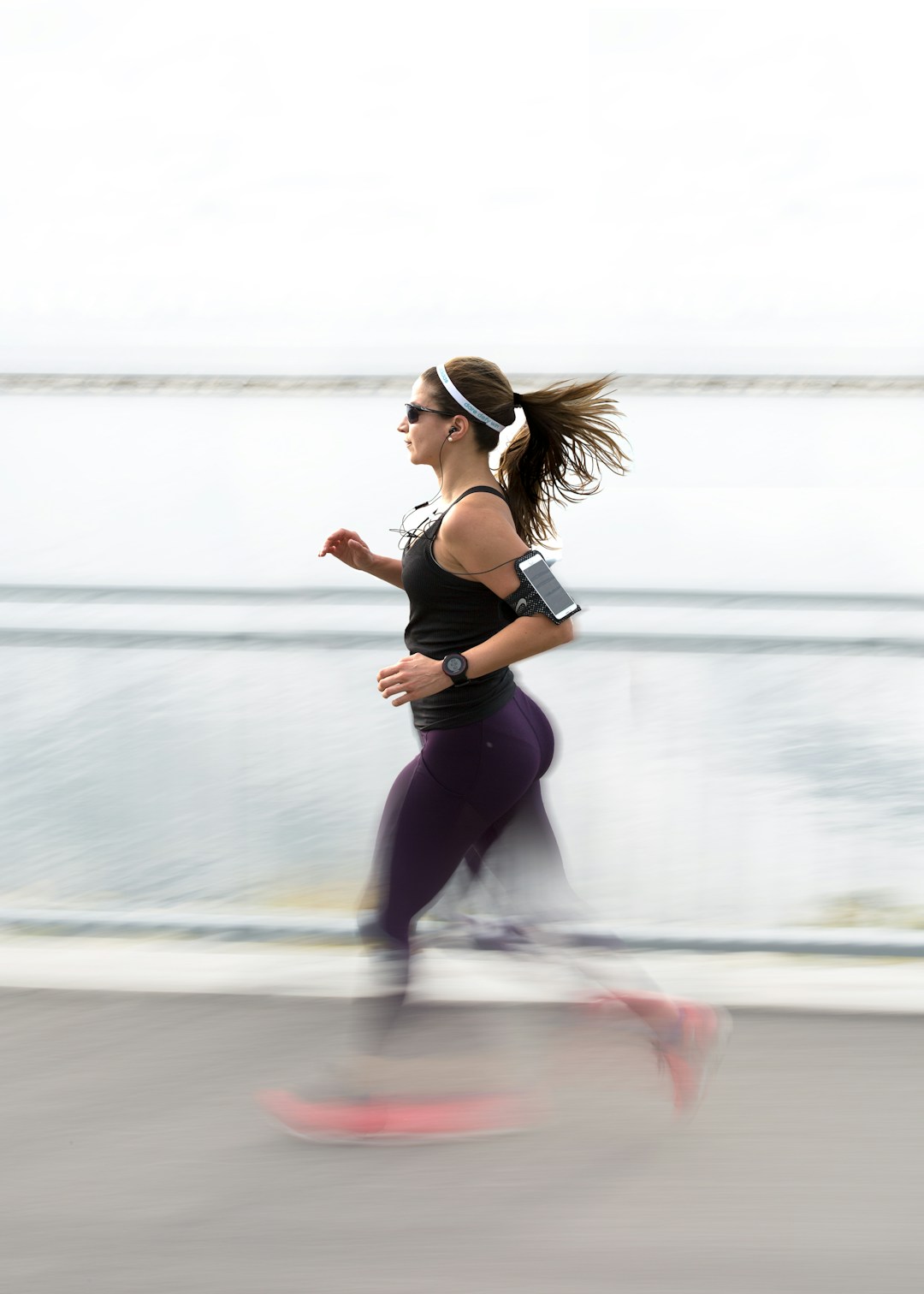 A runner checking their heart rate. Heart rate is the one thing wristbands and rings actually measure well, which is why Pulsyn focuses on physiological signals rather than derived calorie guesses.