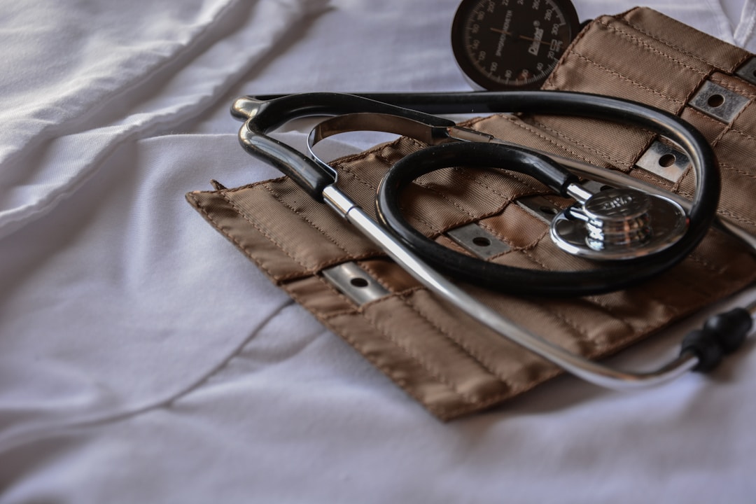 A medical stethoscope on a desk with clinical documents, representing the regulatory gap between wellness devices and validated medical equipment