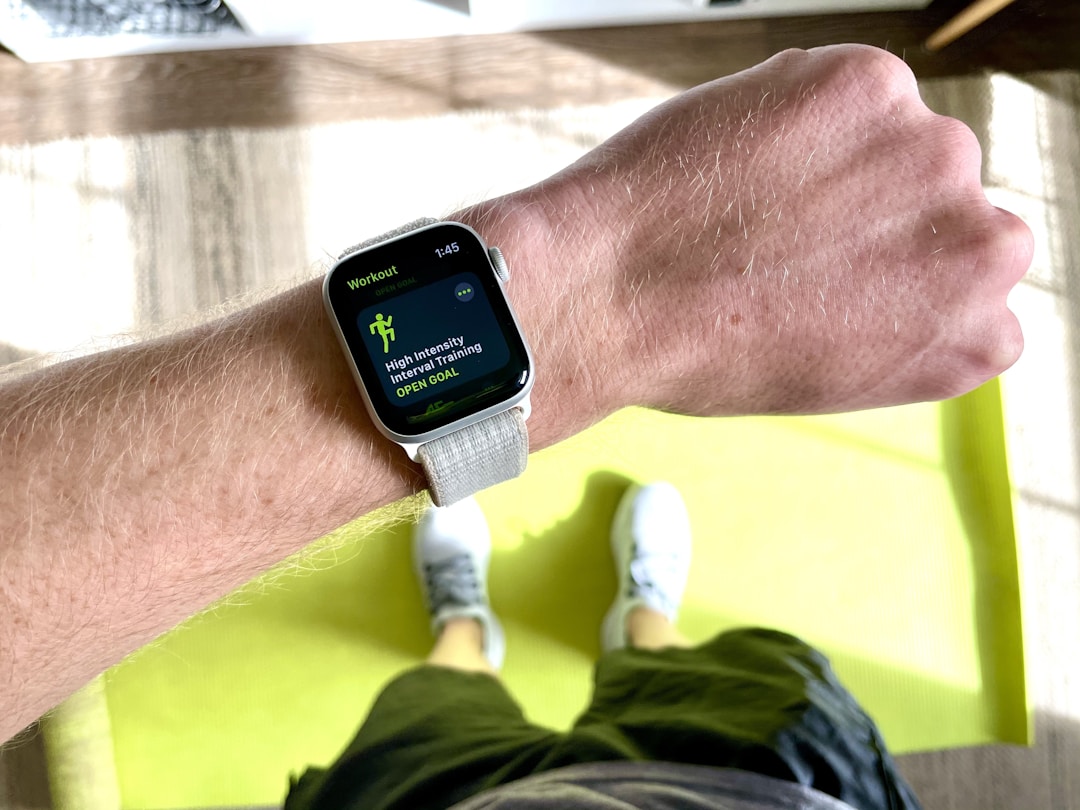 A wearable fitness tracker on a wrist, demonstrating the visual language of health authority that most wellness devices use in marketing